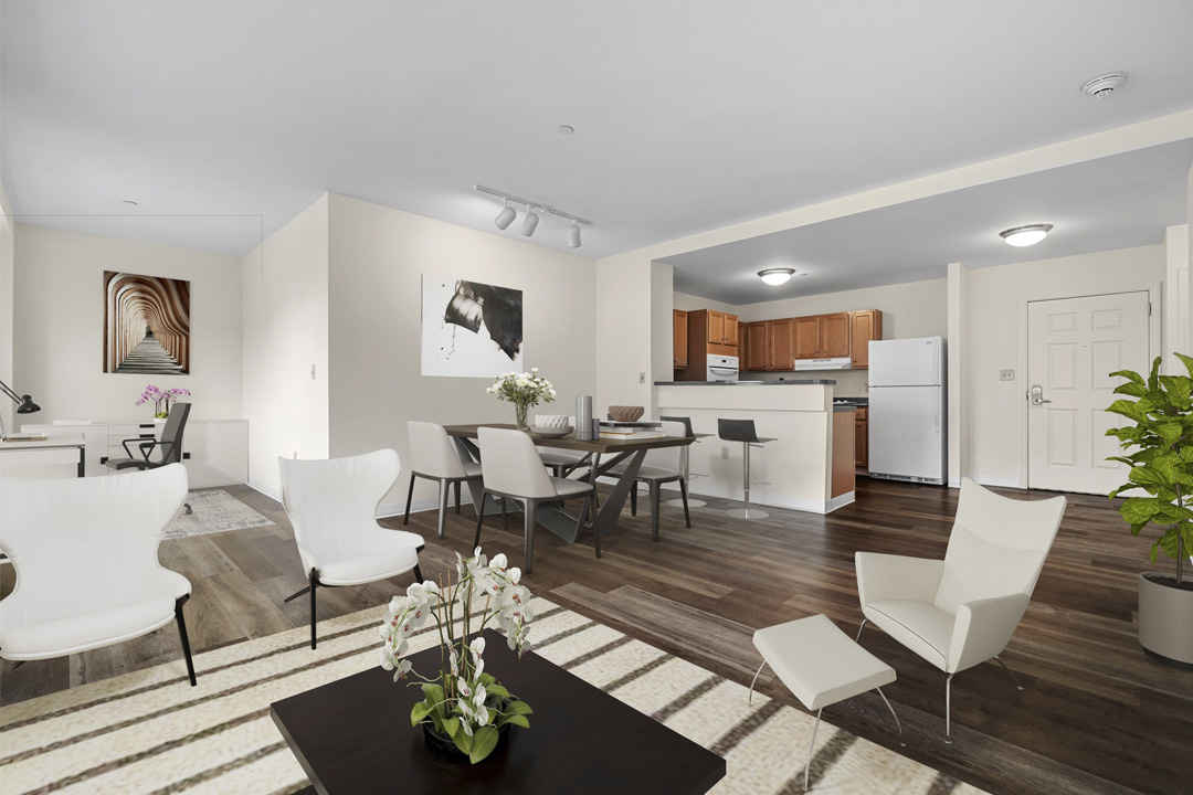 Open floor plan with dining space near the breakfast bar kitchen.