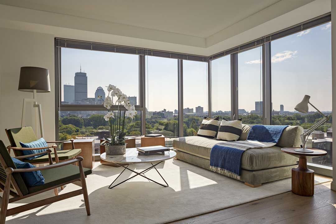 Beautiful luxury unit with a large corner wall of floor to ceiling windows overlooking Boston