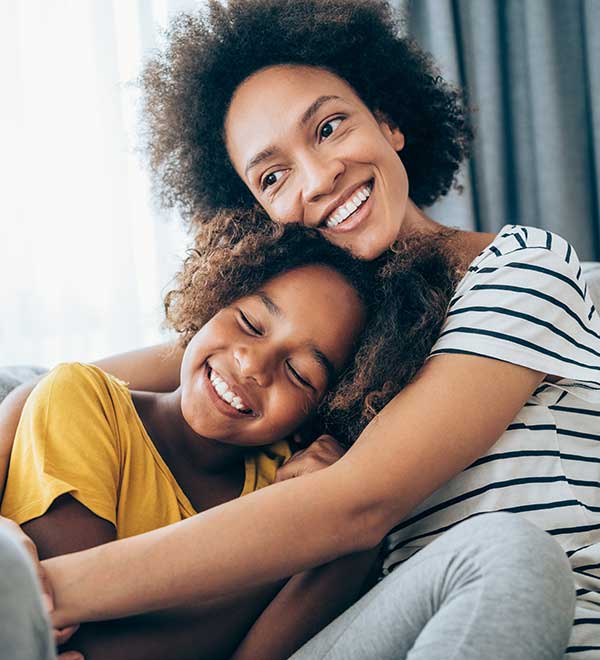 Happy mother and child cozy together at home