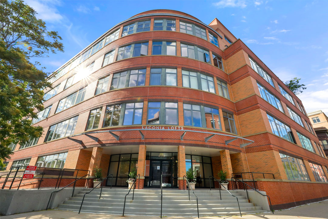 Modern rounded entry way, 5 levels, glass and brick.