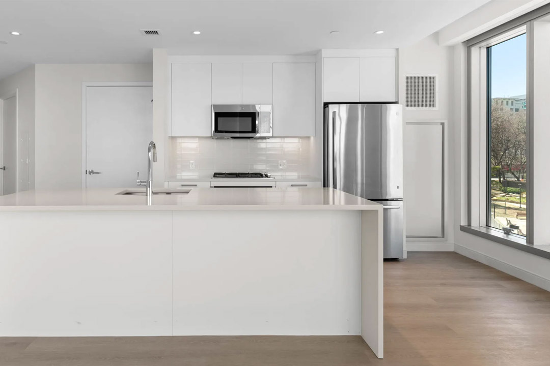 Beautiful modern kitchen, all white and silver - clean and crisp.