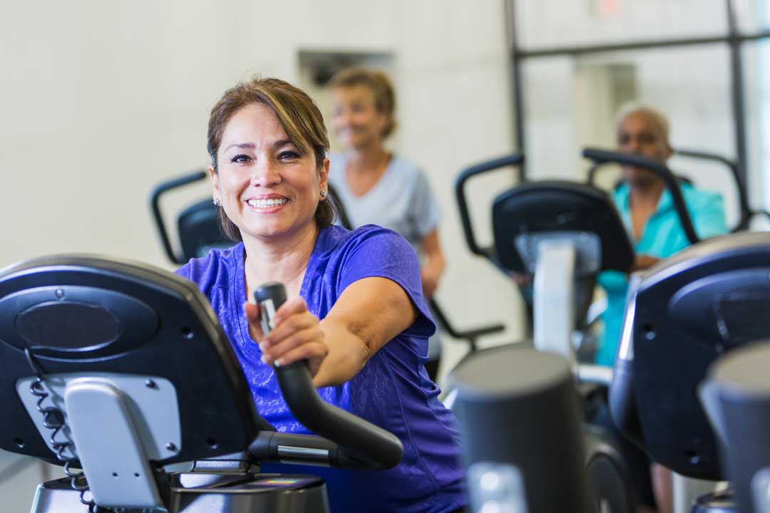 Woman using exercise equipment in a fitness center