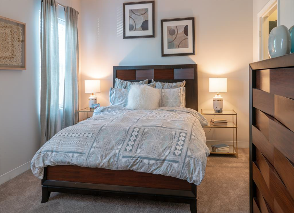 bedroom with window and carpeting