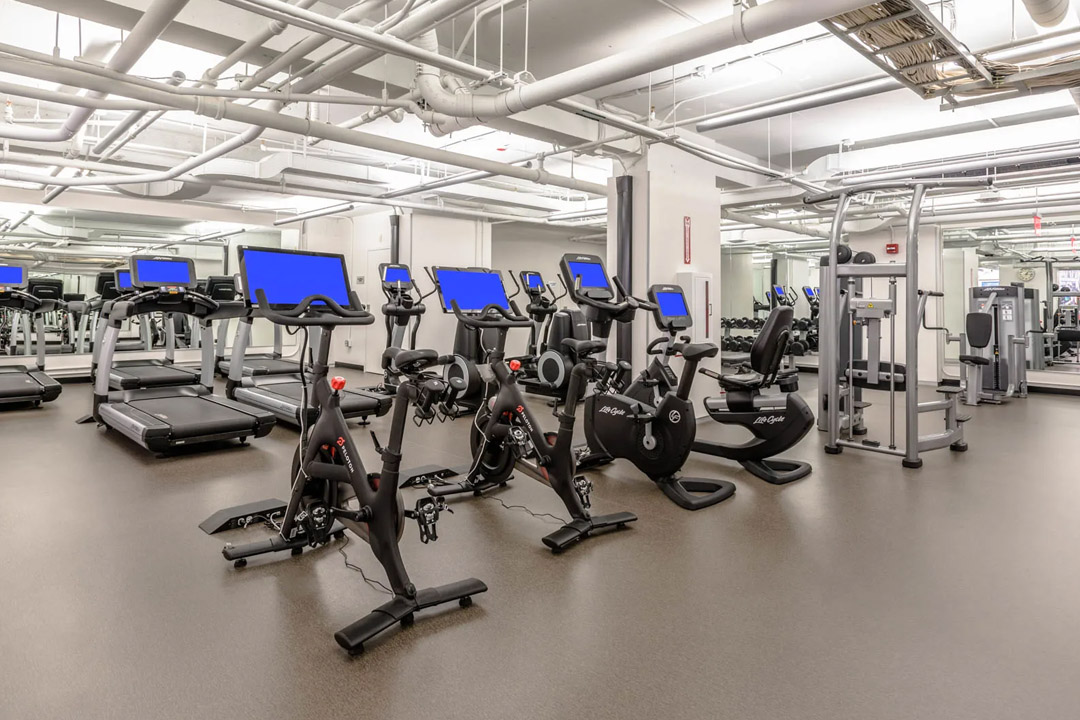 Large fitness center offering a variety of equipment.