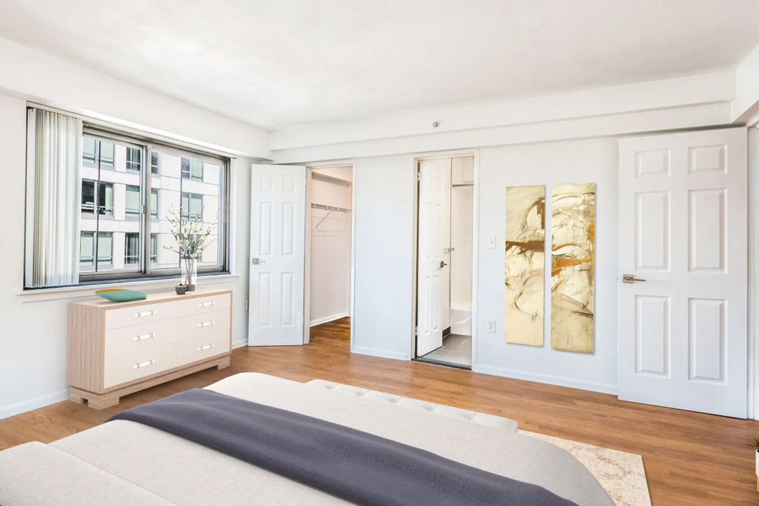 Model view of bedroom with closets and large windows