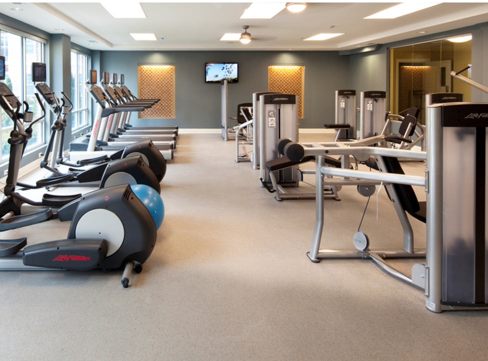 Large fitness center offering a variety of equipment.