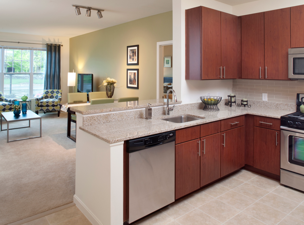 modern Kitchen with cherry cabinets and stainless steel appliances