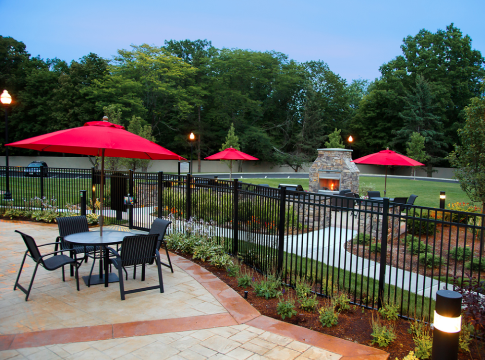patio area with tables and umbrellas at 460 River Rd