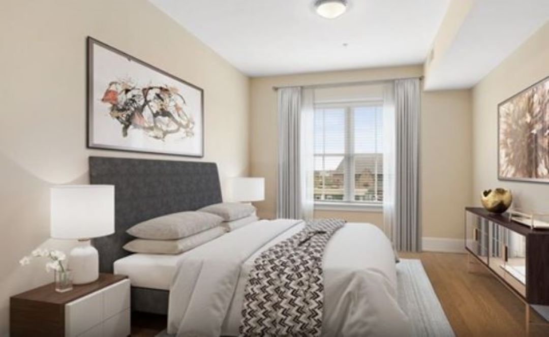 Brightly lit bedroom with large window at 375 Market St.