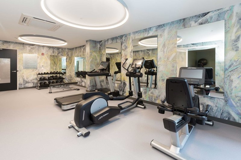 Large fitness center offering a variety of equipment.