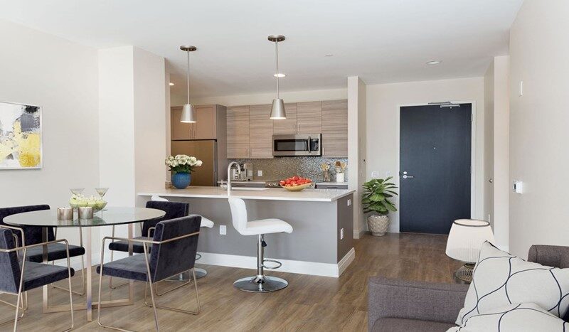 Open layout with a modern kitchen and breakfast bar.