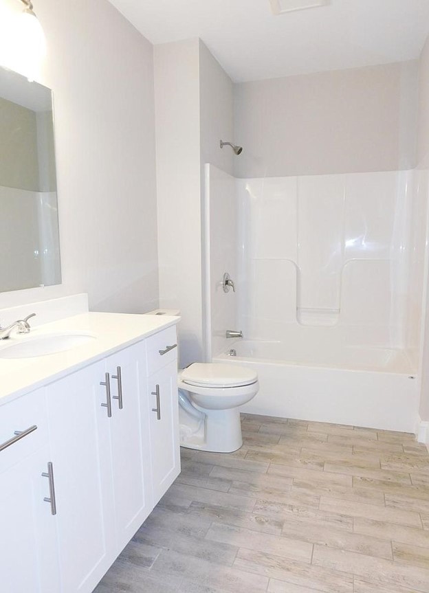 Clean, bright, white, modern bathroom.