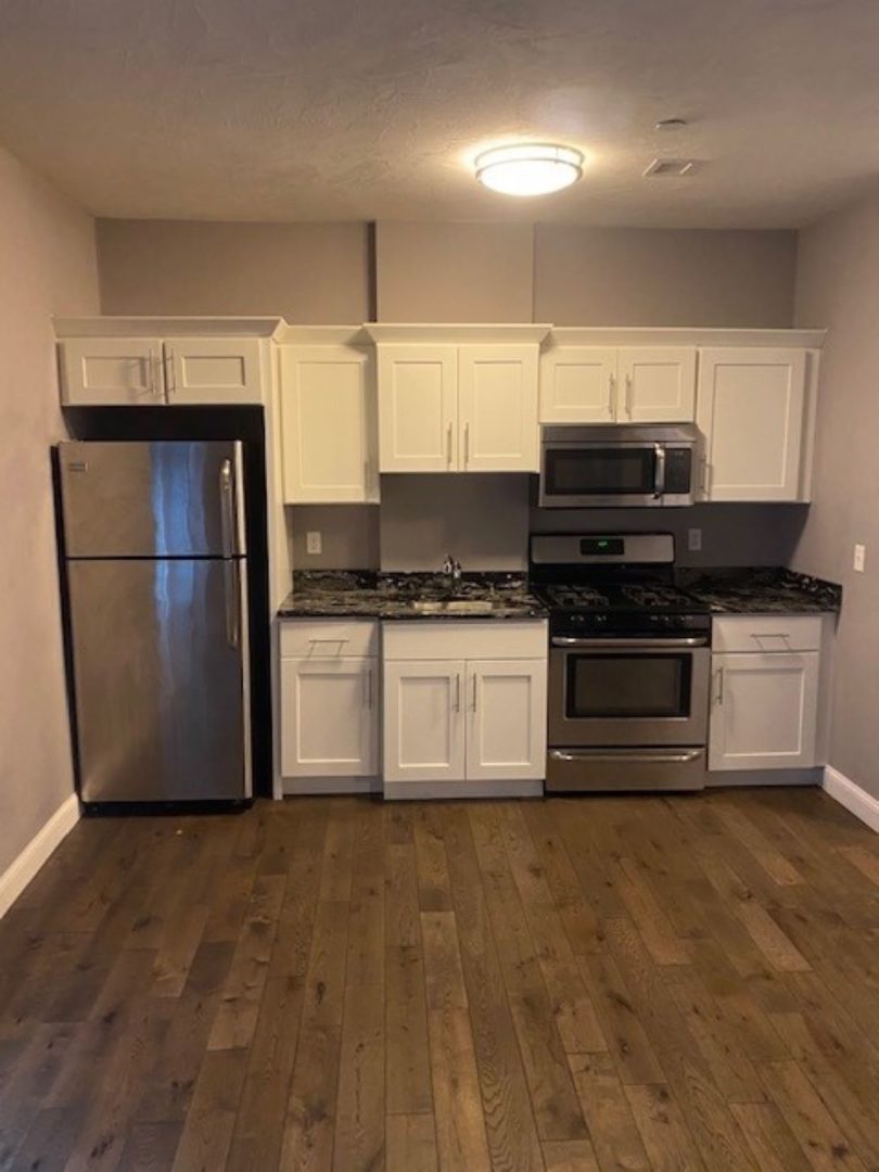 modern kitchen with white cabinets at 41 Saratoga Street