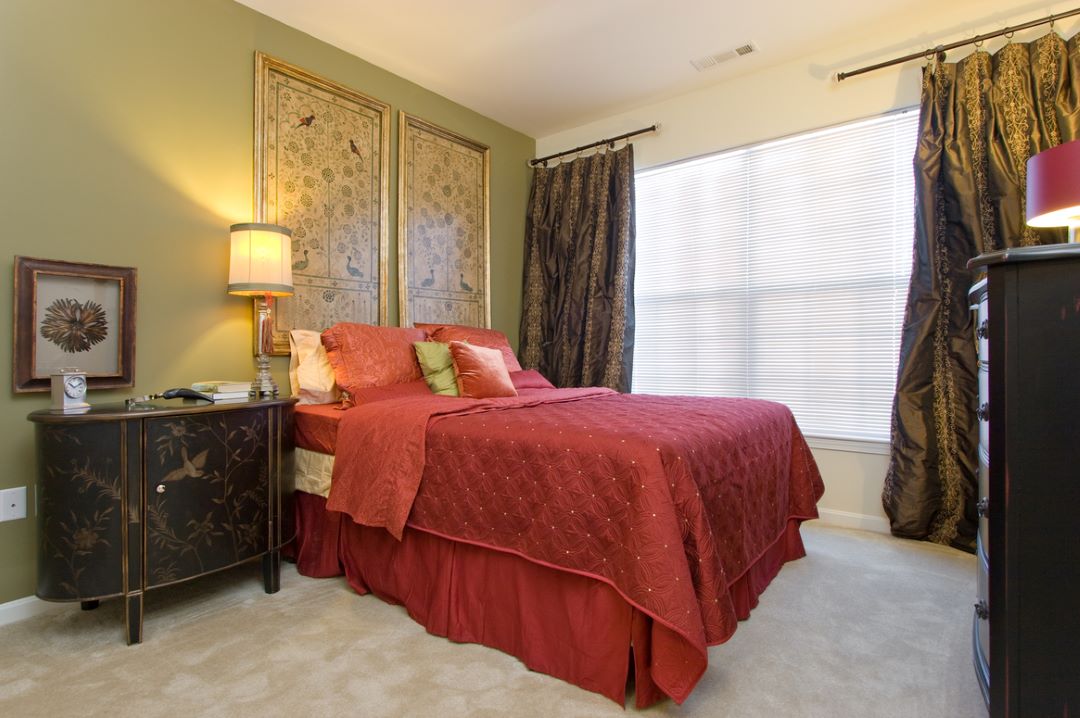 beautiful bedroom with light beige carpet at 311 Lowell St