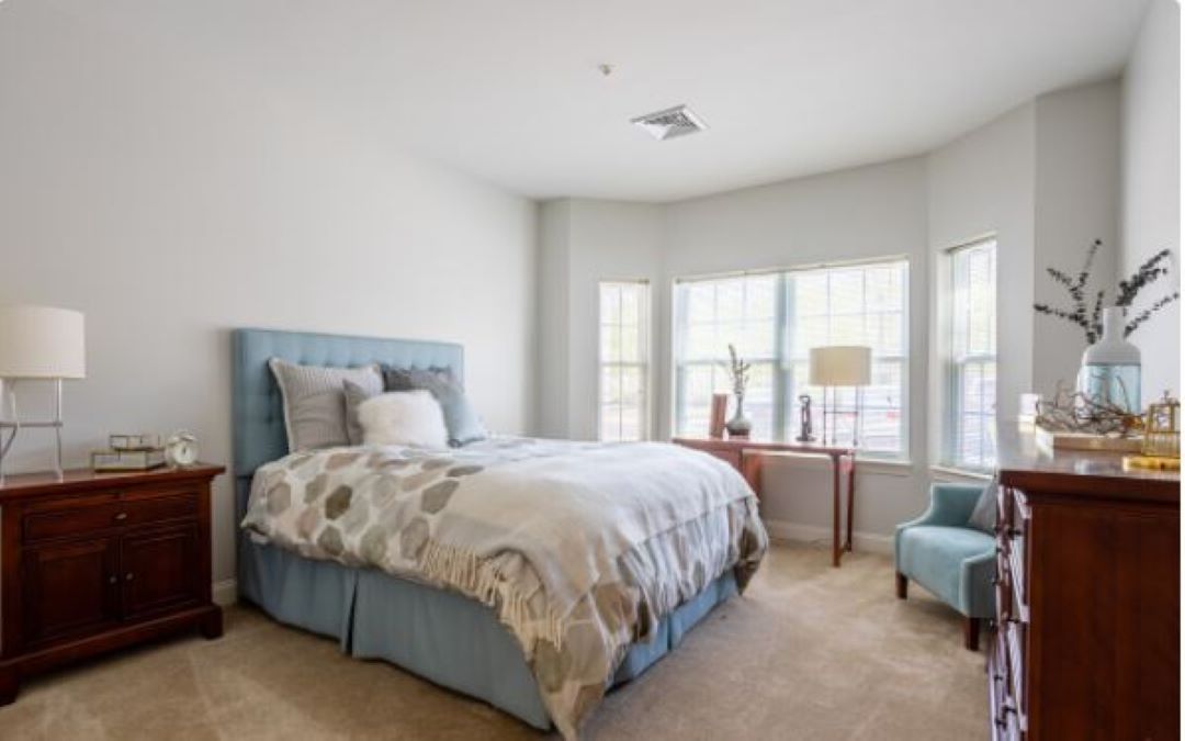 beautiful bedroom with beige carpets at 100 Thompson Farm