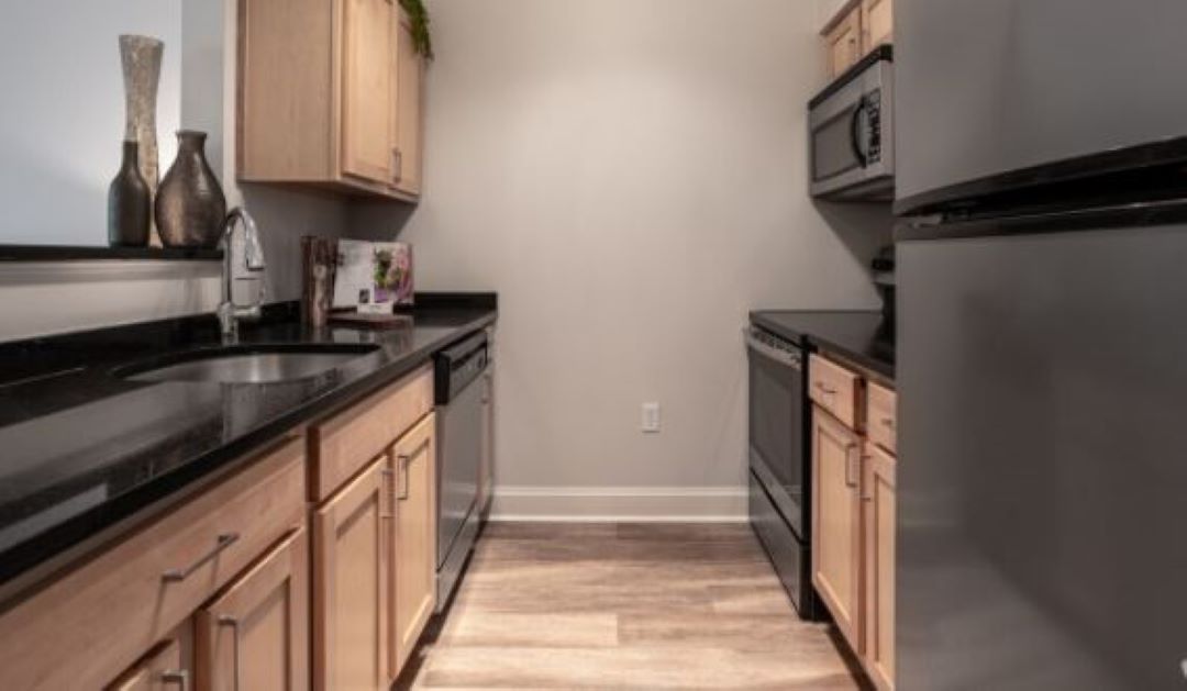 updated kitchen with hardwood floors at 100 Thompson Farm