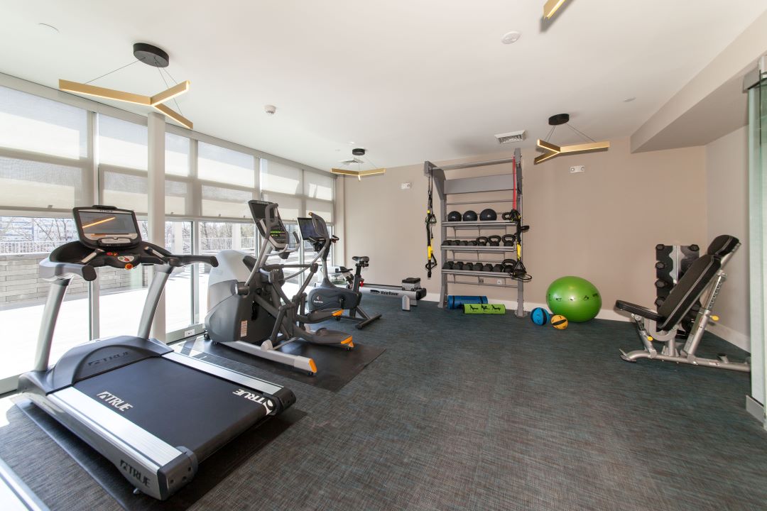 large fitness center with windows at 20 Second Avenue