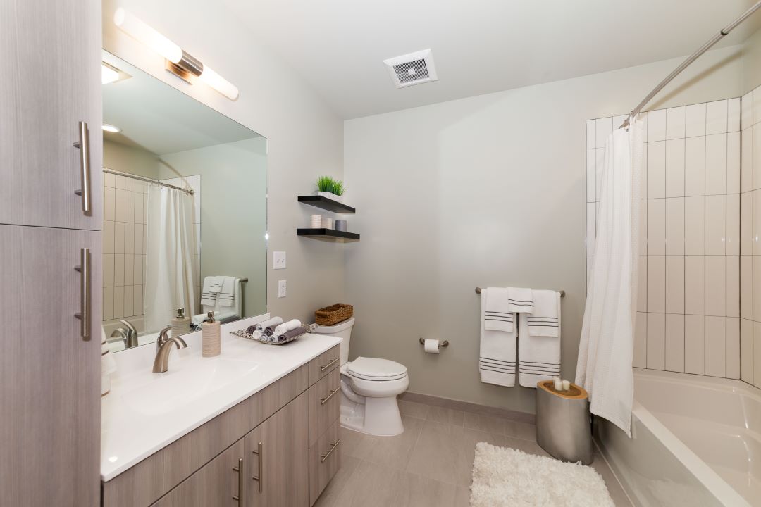 modern bathroom with large vanity at 20 Second Avenue