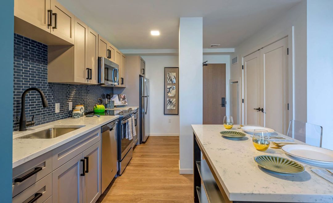 Kitchen with modern fixtures and countertops