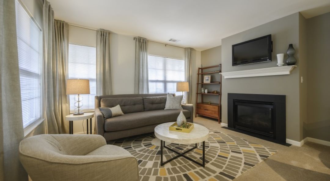 Living room with electric fireplace and mantle