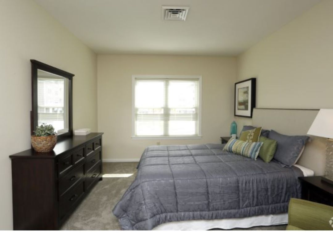 Bedroom with rugged floors