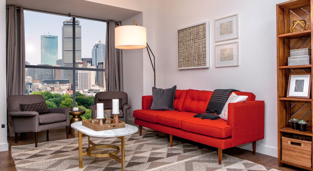 Living room with hardwood floors and skyline views