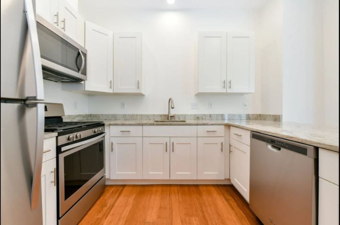 updated, white kitchen at 245 Sumner Street