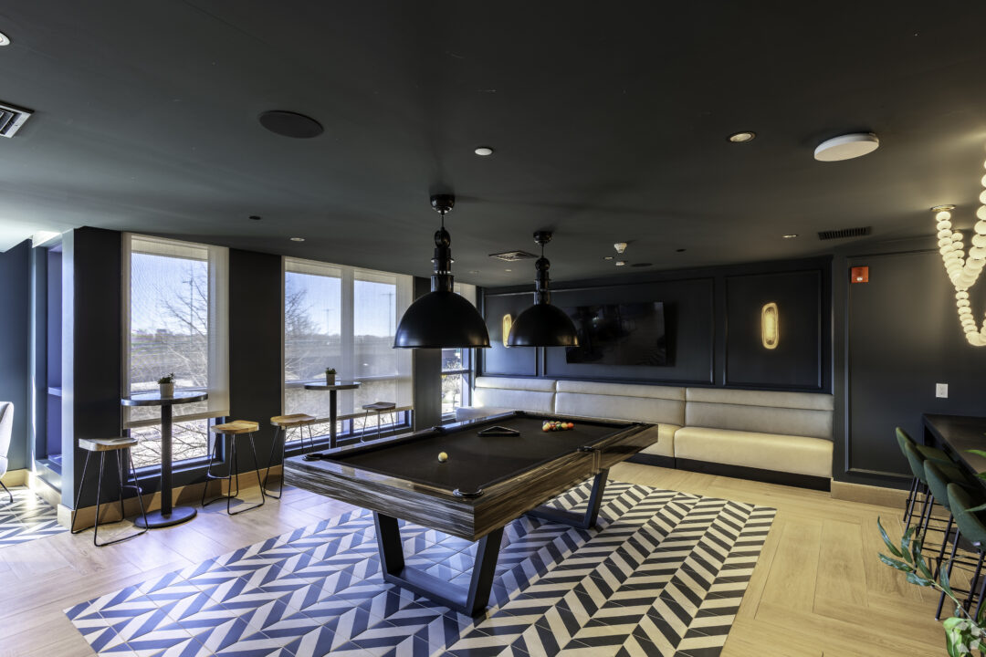 game room with pool table and overhead lights