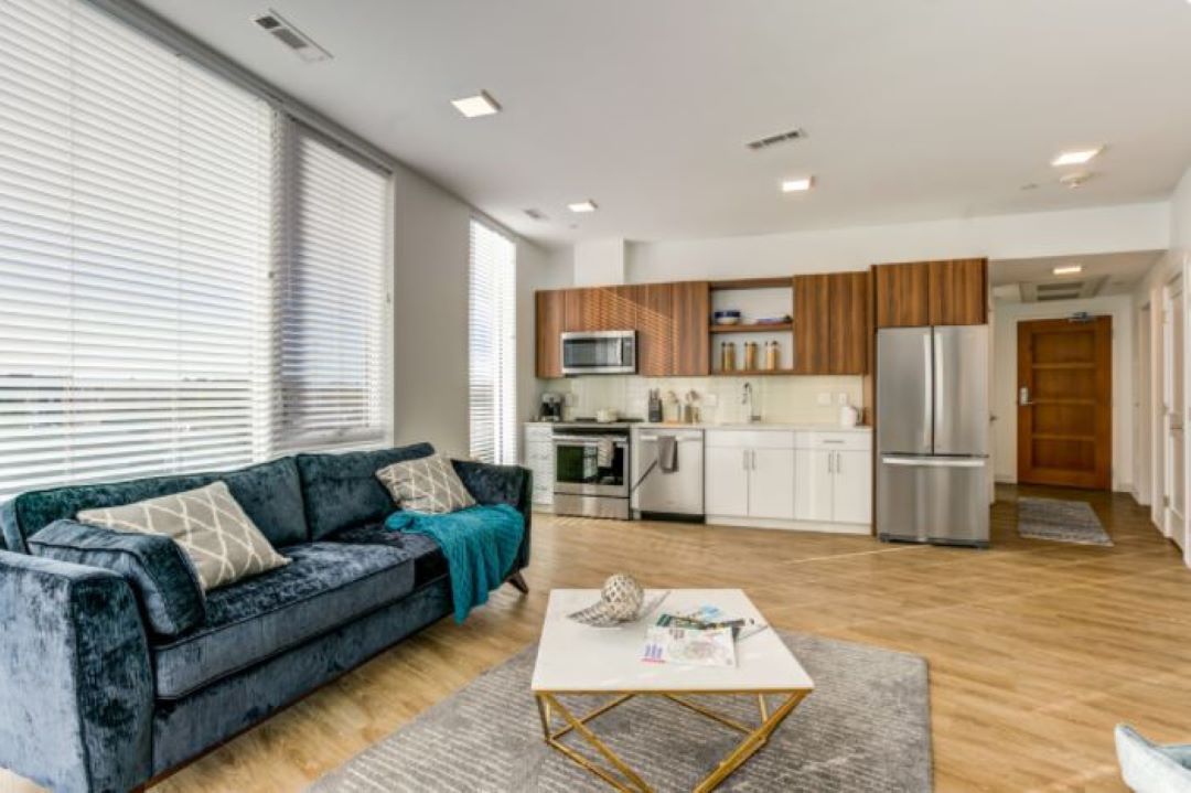 open concept kitchen and living room with hardwood floors at 530 Western Avenue