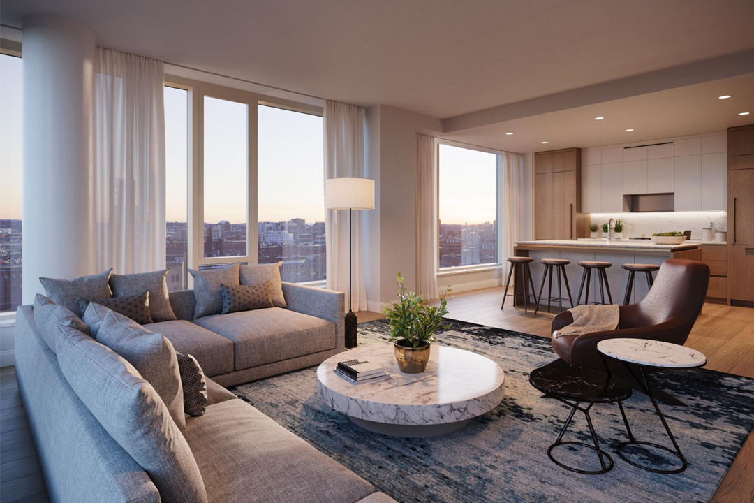 Open floor plan with kitchen island overlooking the living space with huge windows and skyline views.