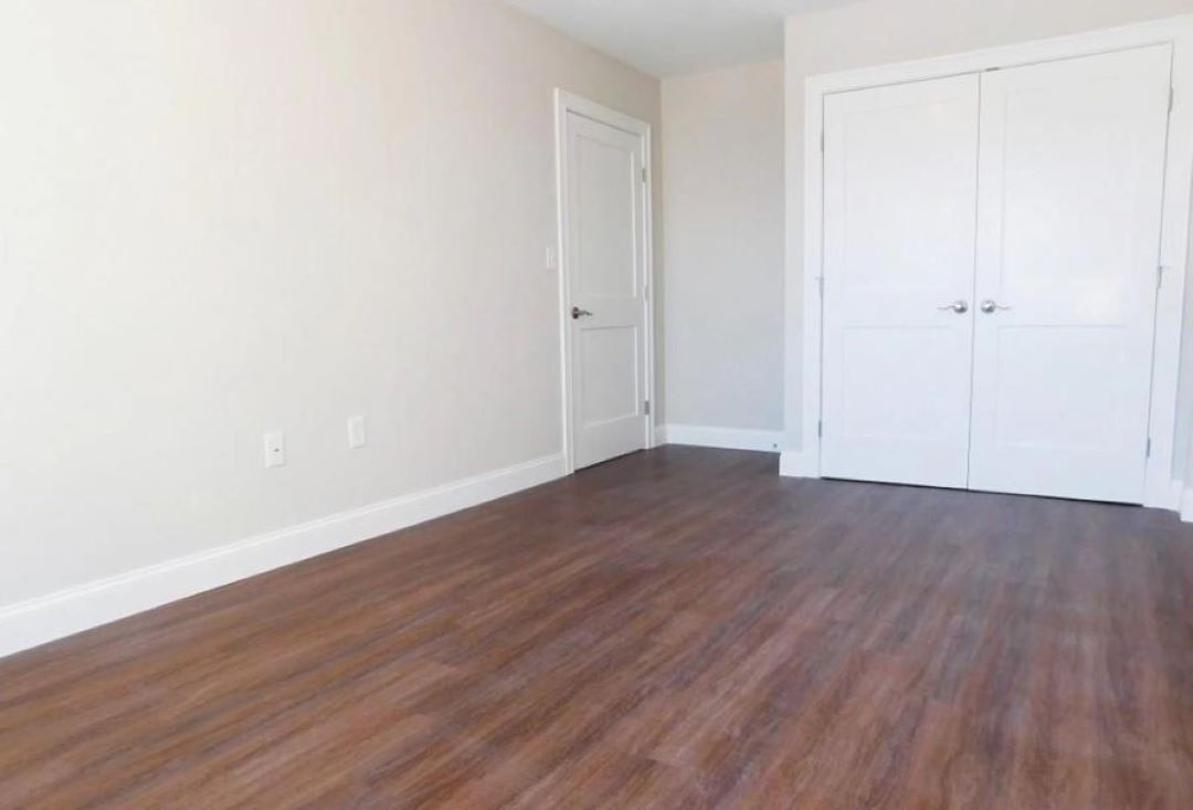 bedroom with hard wood floors at 32 Harris St.