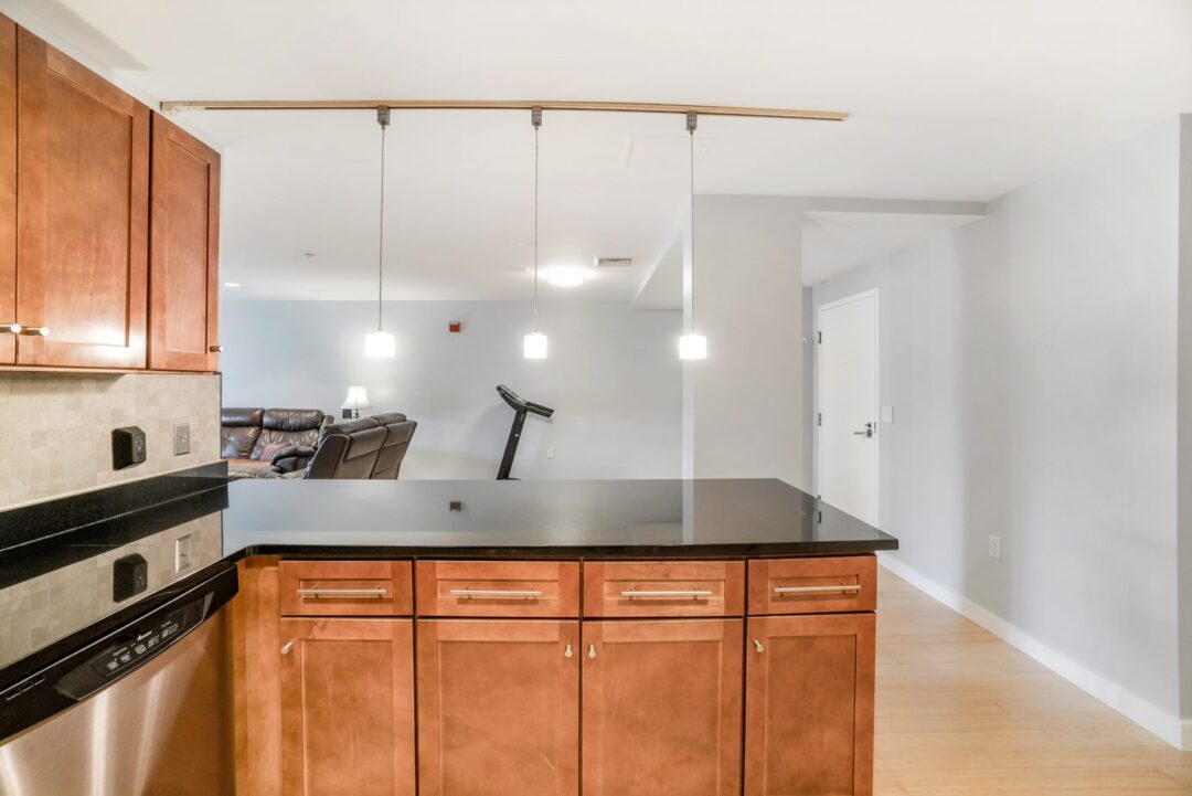 modern kitchen with breakfast bar and pendent lighted