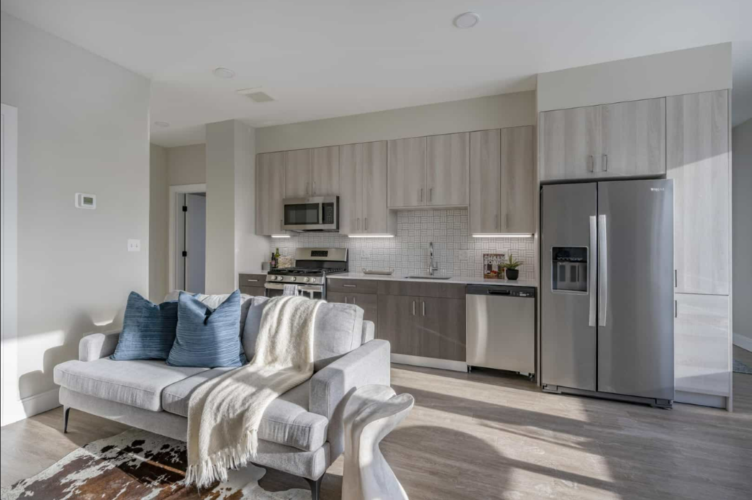 Open floor plan living room leading to kitchen