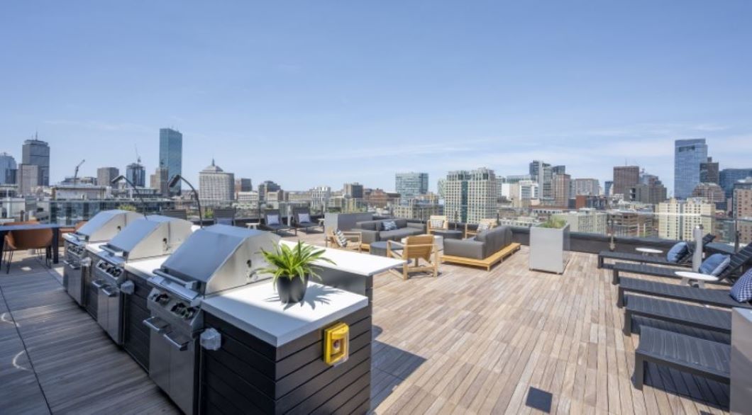 Beautiful Roof deck with grills and chairs for enjoying summer days
