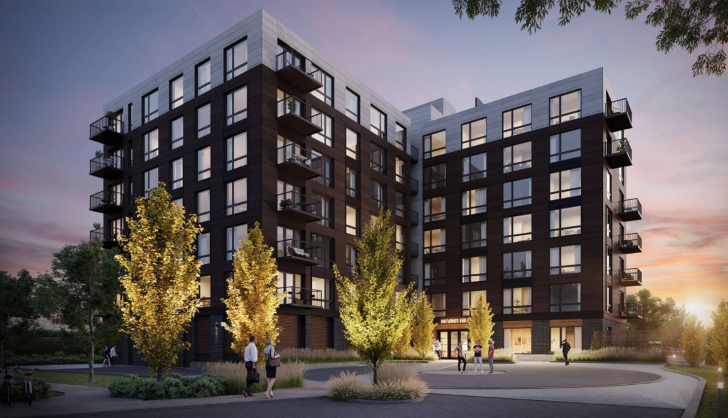 Exterior of 7-story condo building with landscaped outdoor foyer