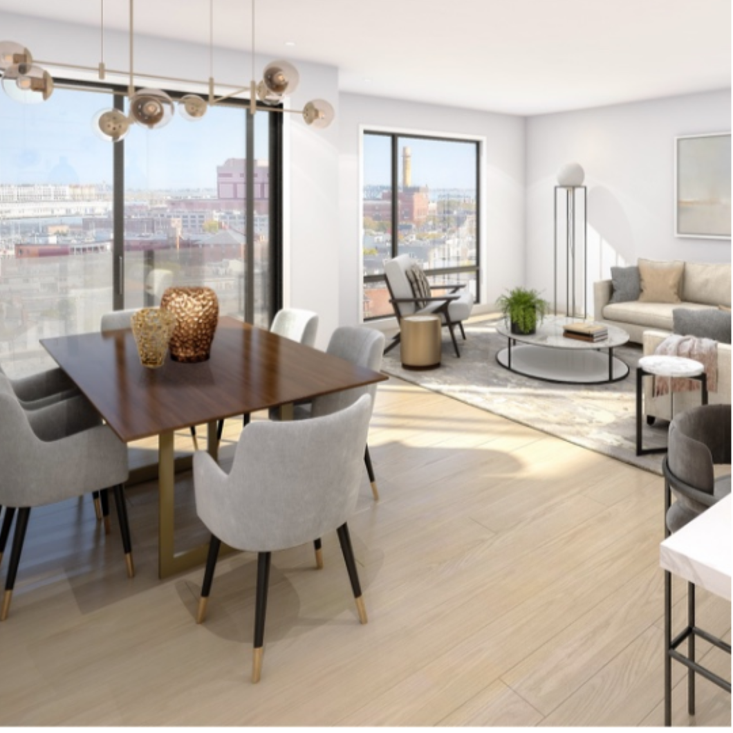 Living room with white walls, tall windows, and hardwood floors