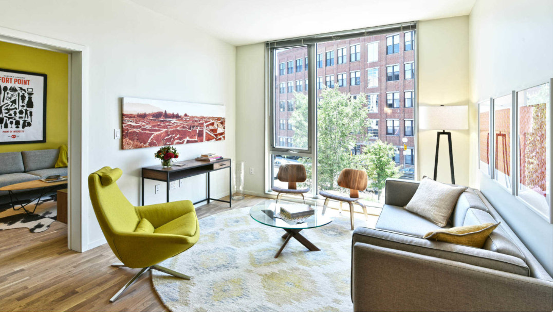 Striking and modern living space with floor to ceiling windows