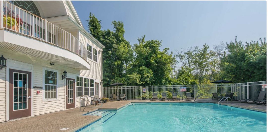 Big, Beautiful pool surrounded by outdoor deck/patio space