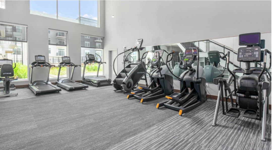 Large fitness center offering a variety of equipment.