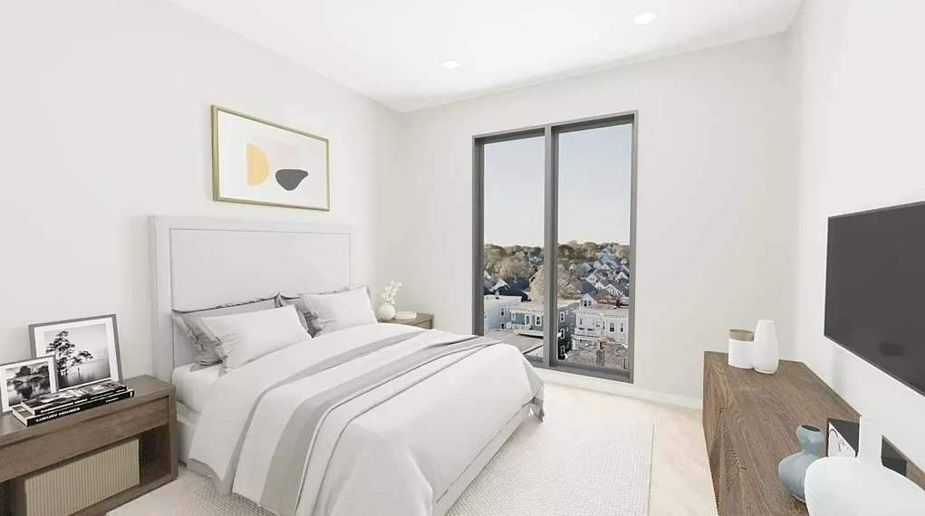Bedroom with white walls and hardwood floors