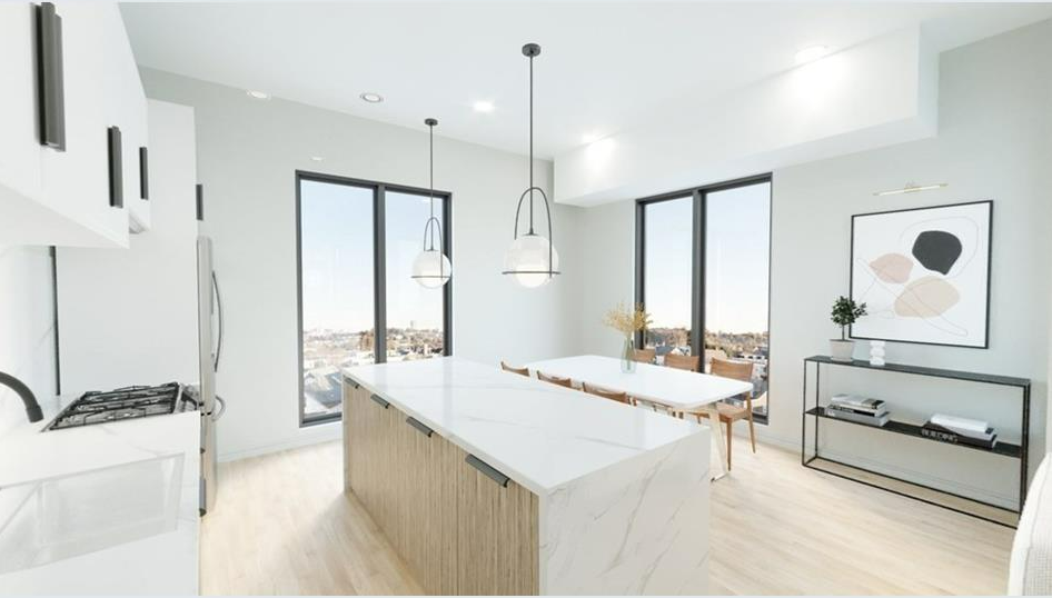Modern kitchen with breakfast bar, hardwood floors stainless steel appliances open to living room