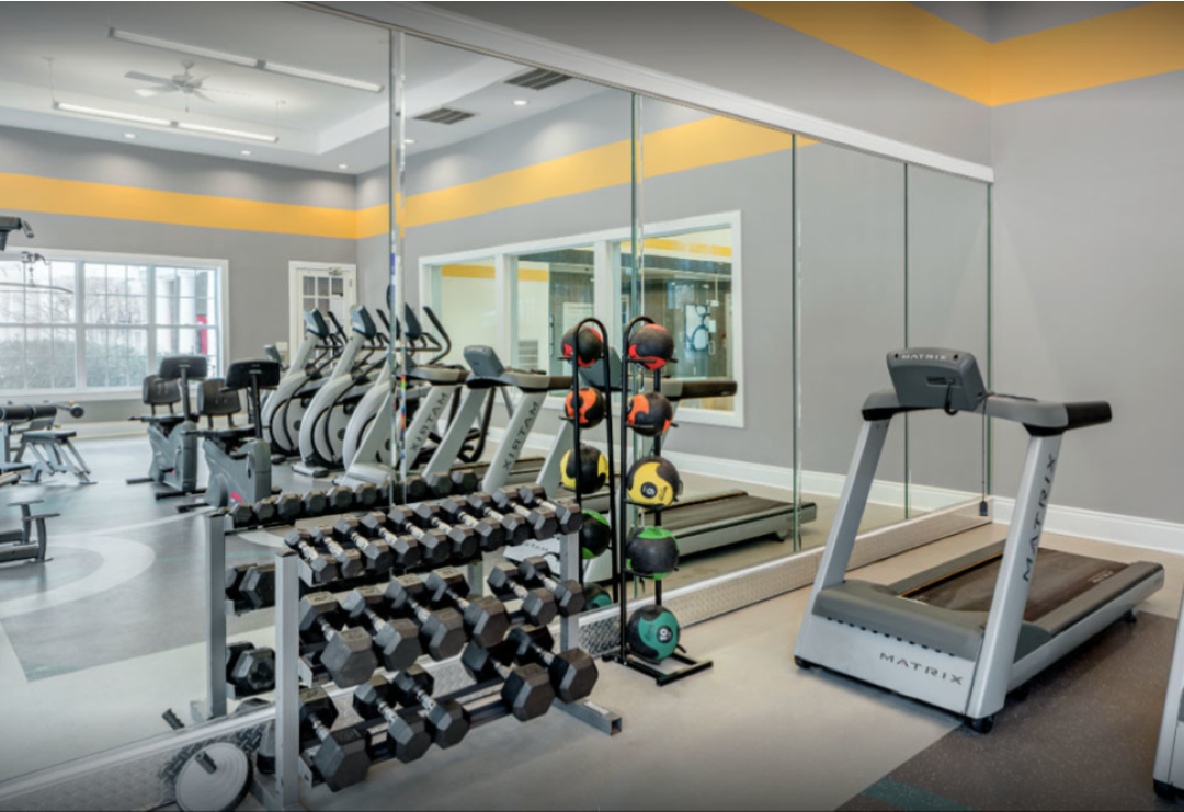 Large fitness center offering a variety of equipment