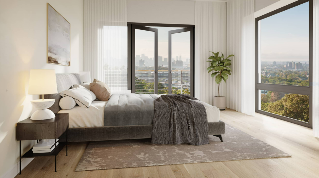 Bedroom with hardwood floors, white walls, and ceiling-to-floor windows