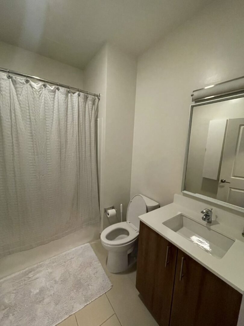 modern bathroom with tile floors, vanity and bathtub