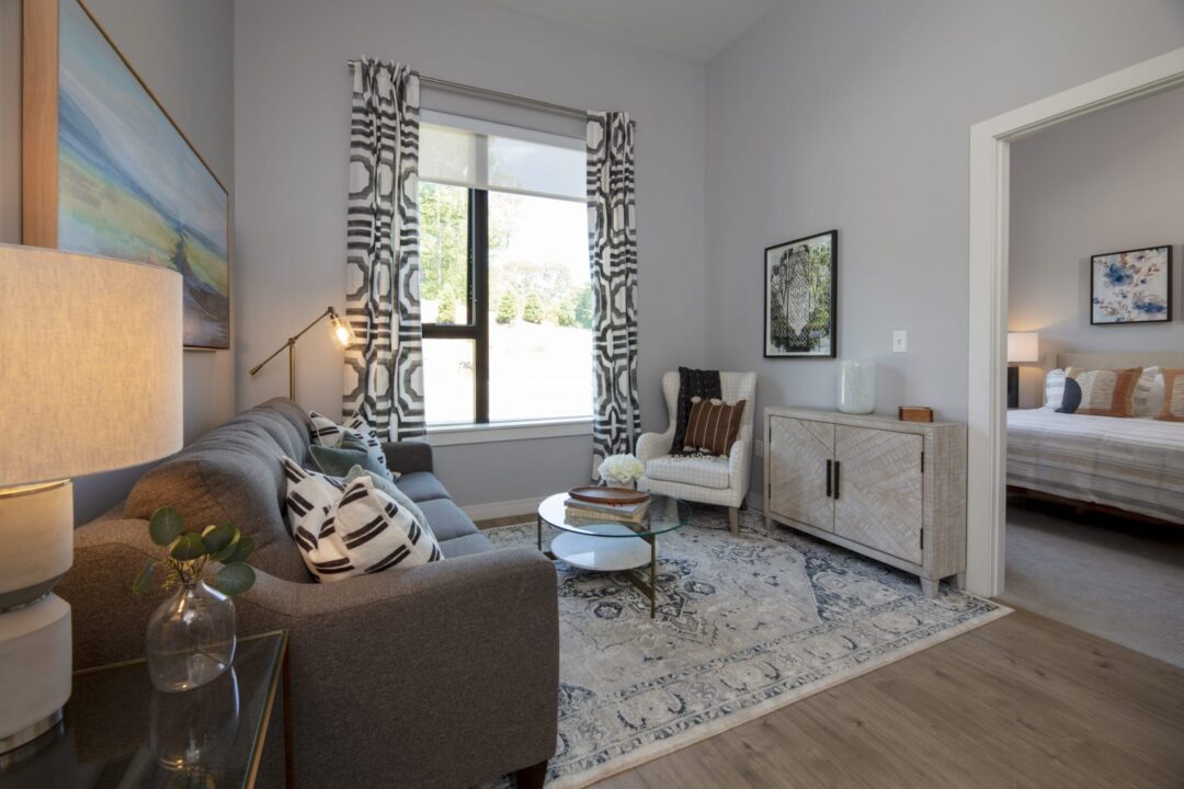 Living room space with hardwood floors, and picture window