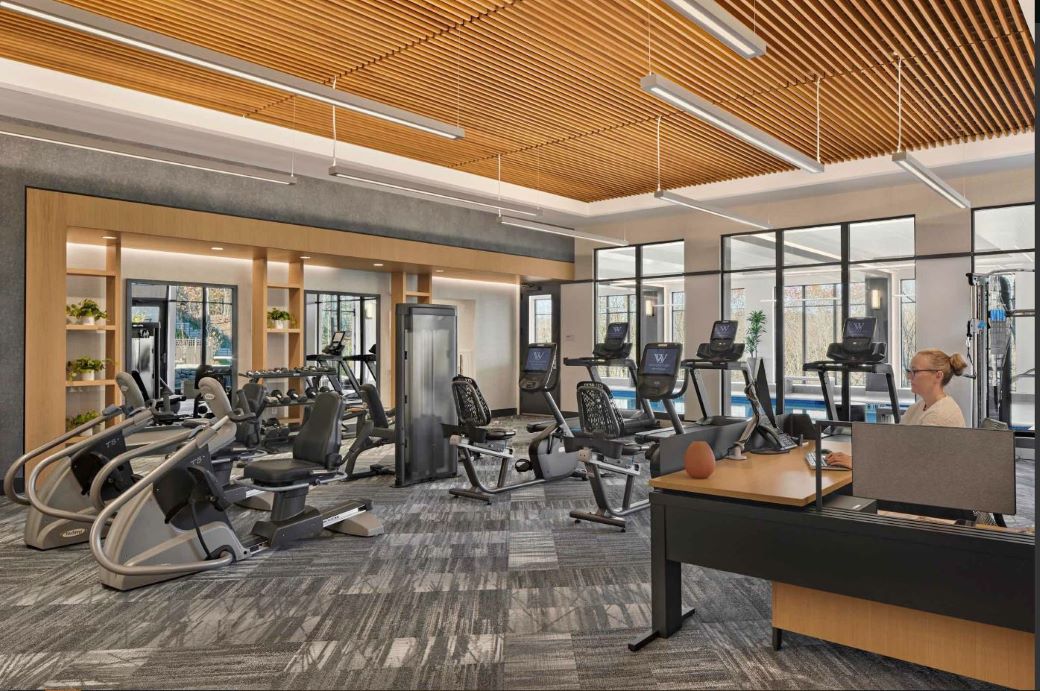 fitness center with an assortment of machines and weights
