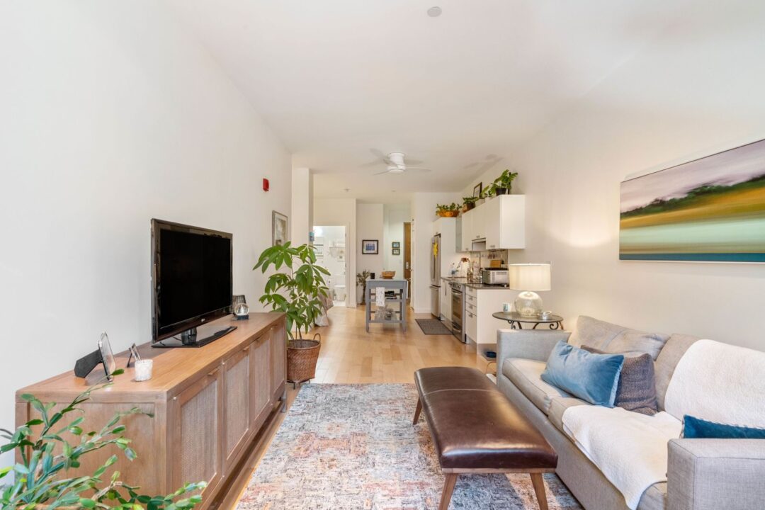 open layout living area with natural light and big windows