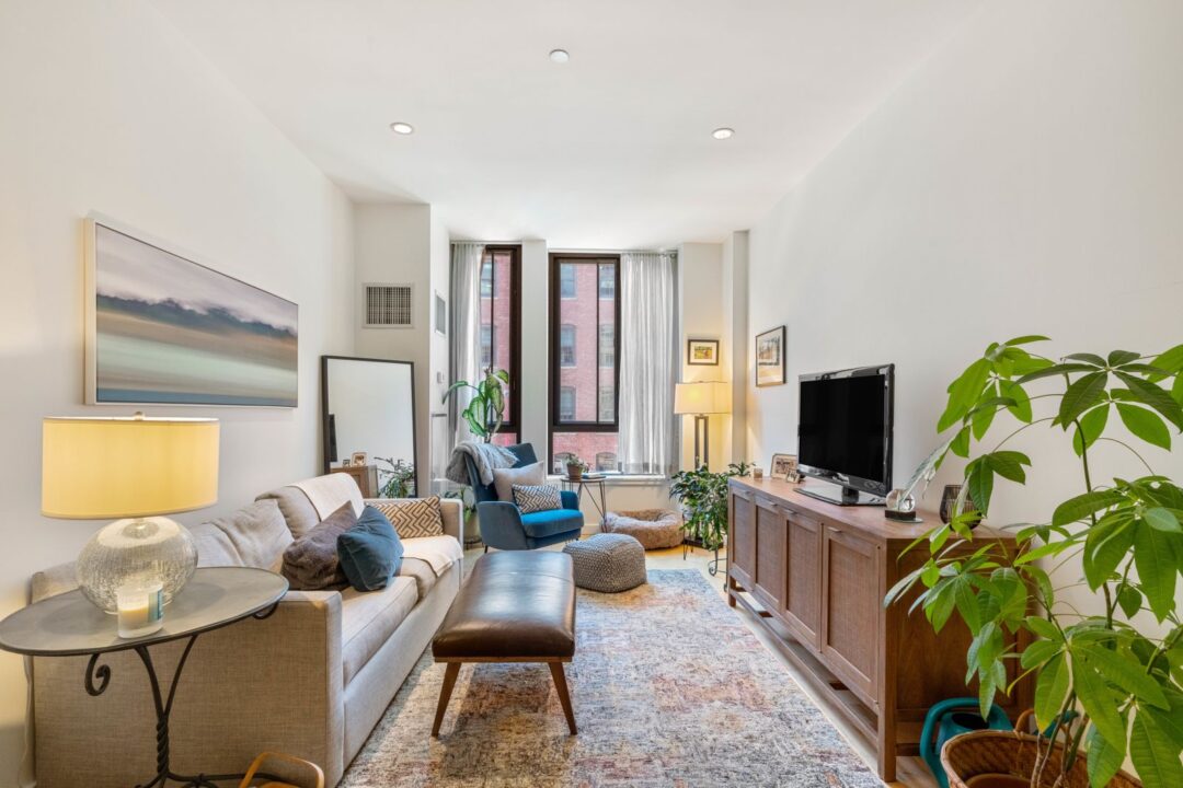 open layout living area with natural light and big windows