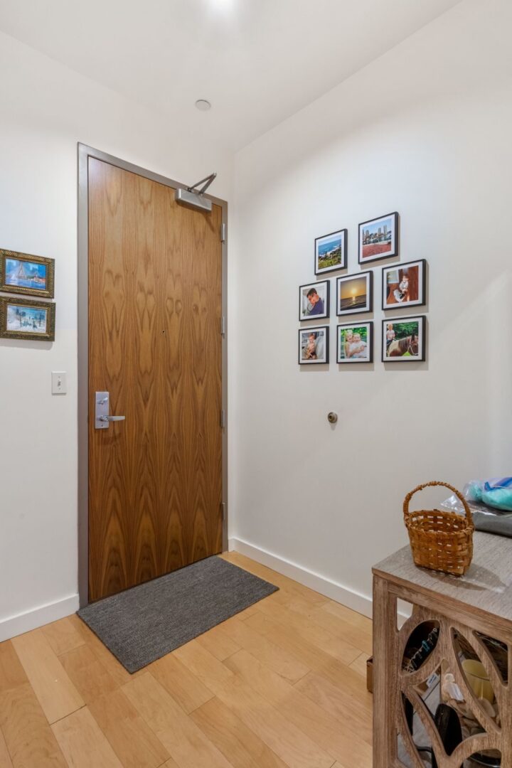 entry way door area with white walls and wood floors