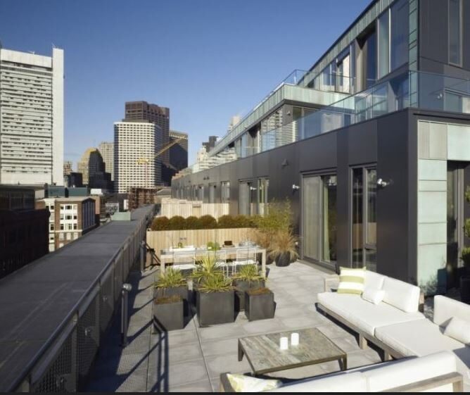 outdoor sitting area on roof of building